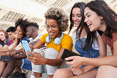 photo of a group of Gen Z people looking at smartphones