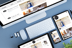 Mobile-Vs-Desktop photo of a desktop computer with 2 tablets and a smartphone