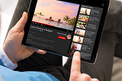 photo of a person watching a YouTube video on a tablet