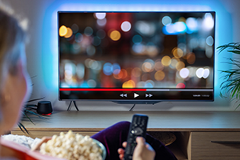 youtube-TV photo of a person watching YouTube on a TV screen