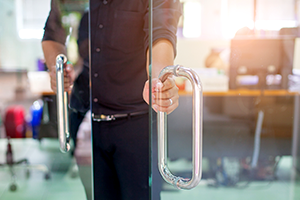 photo of a person opening a door